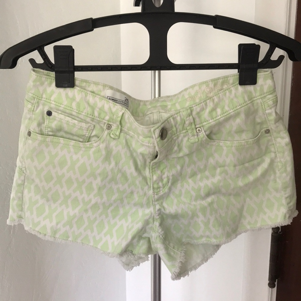 Light green and white cut off shorts